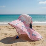 Sombrero con silbato azul y anaranjado y diseño de unicornio